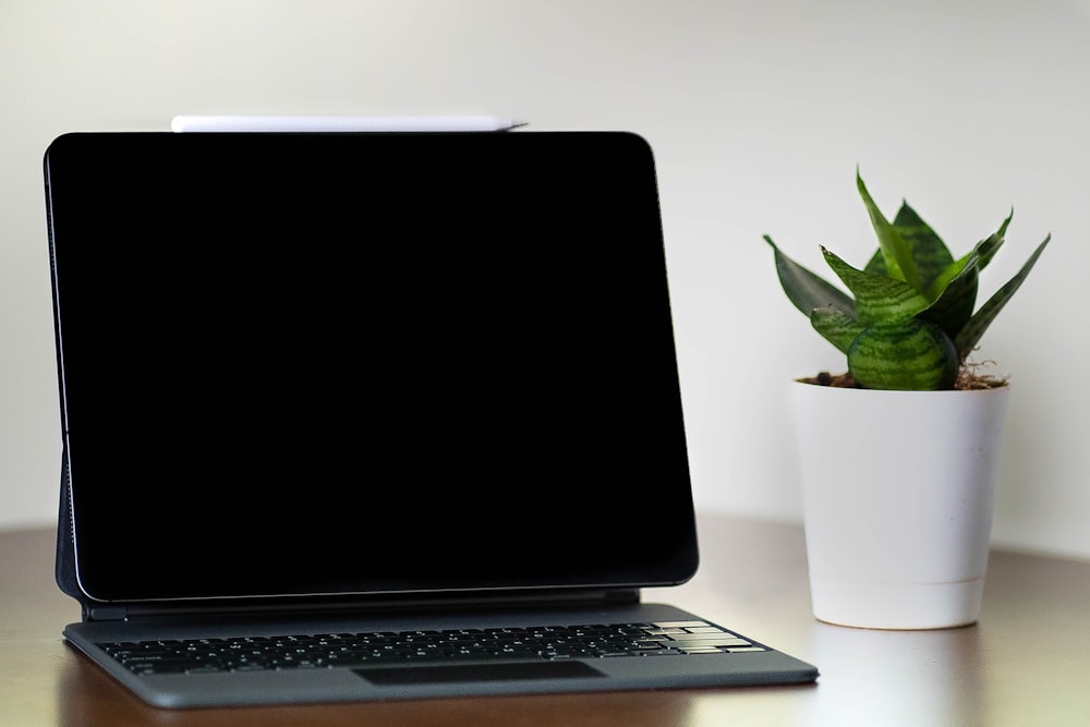 black and silver laptop computer