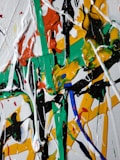 white green red and yellow abstract painting