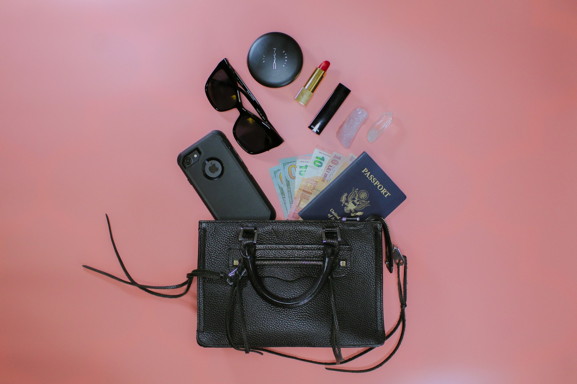 Flat lay featuring makeup and beauty items of a female traveler.
