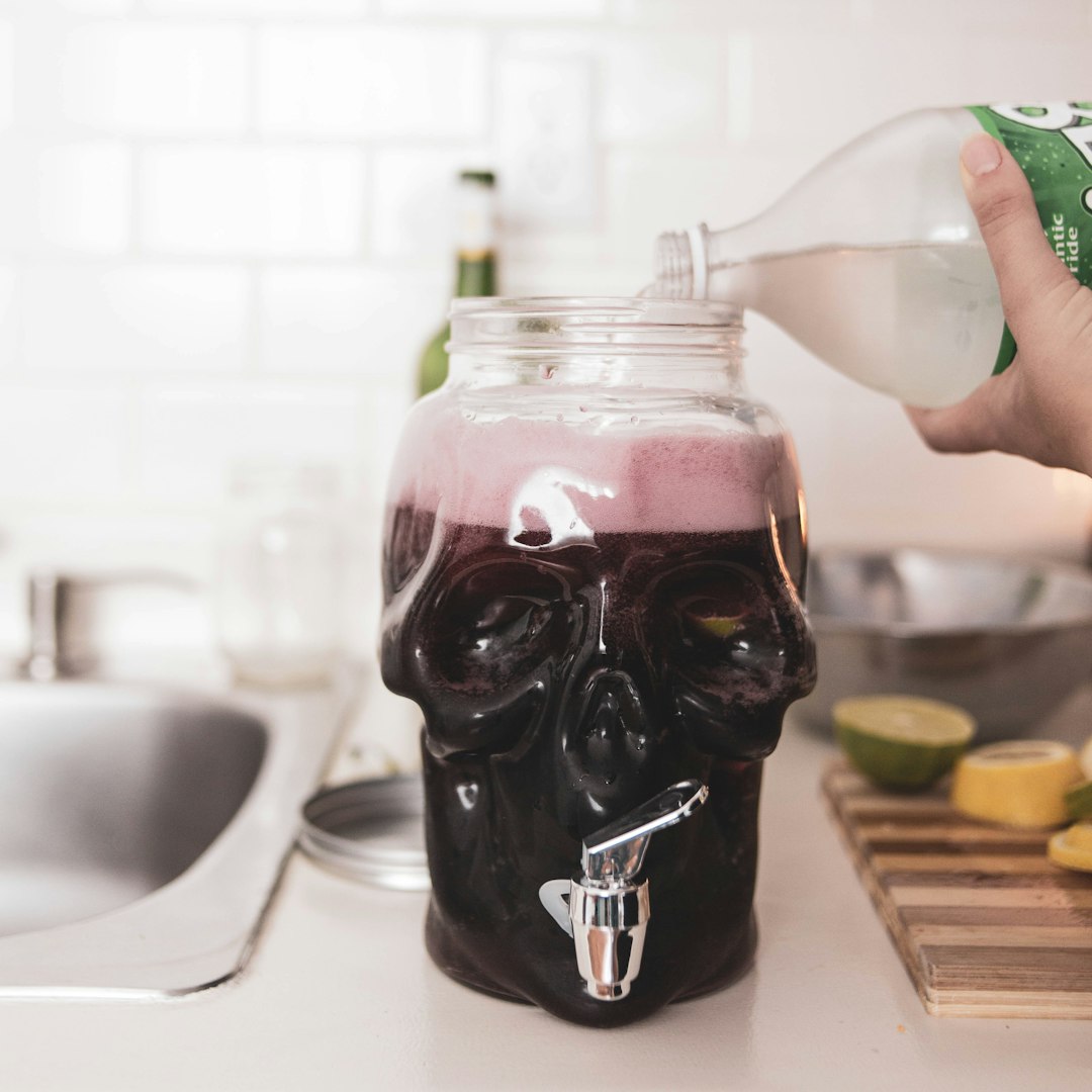 clear glass jar with purple liquid inside