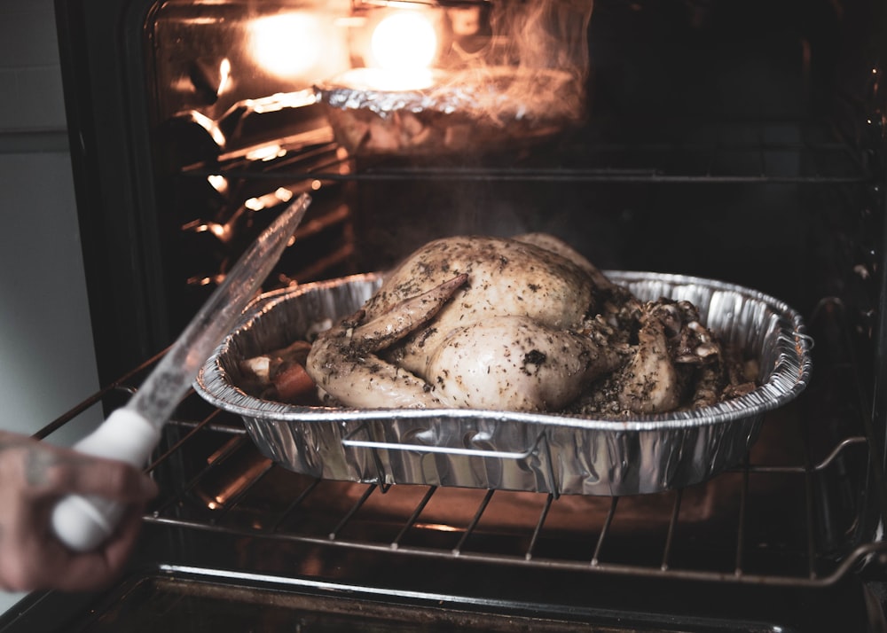 roasted chicken on black metal grill