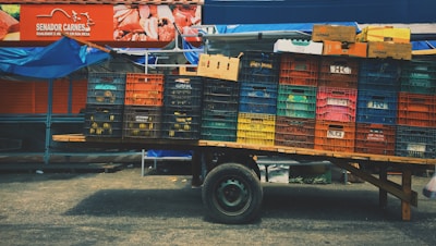 A delivery truck loaded with boxes of cured meat ready to be shipped.