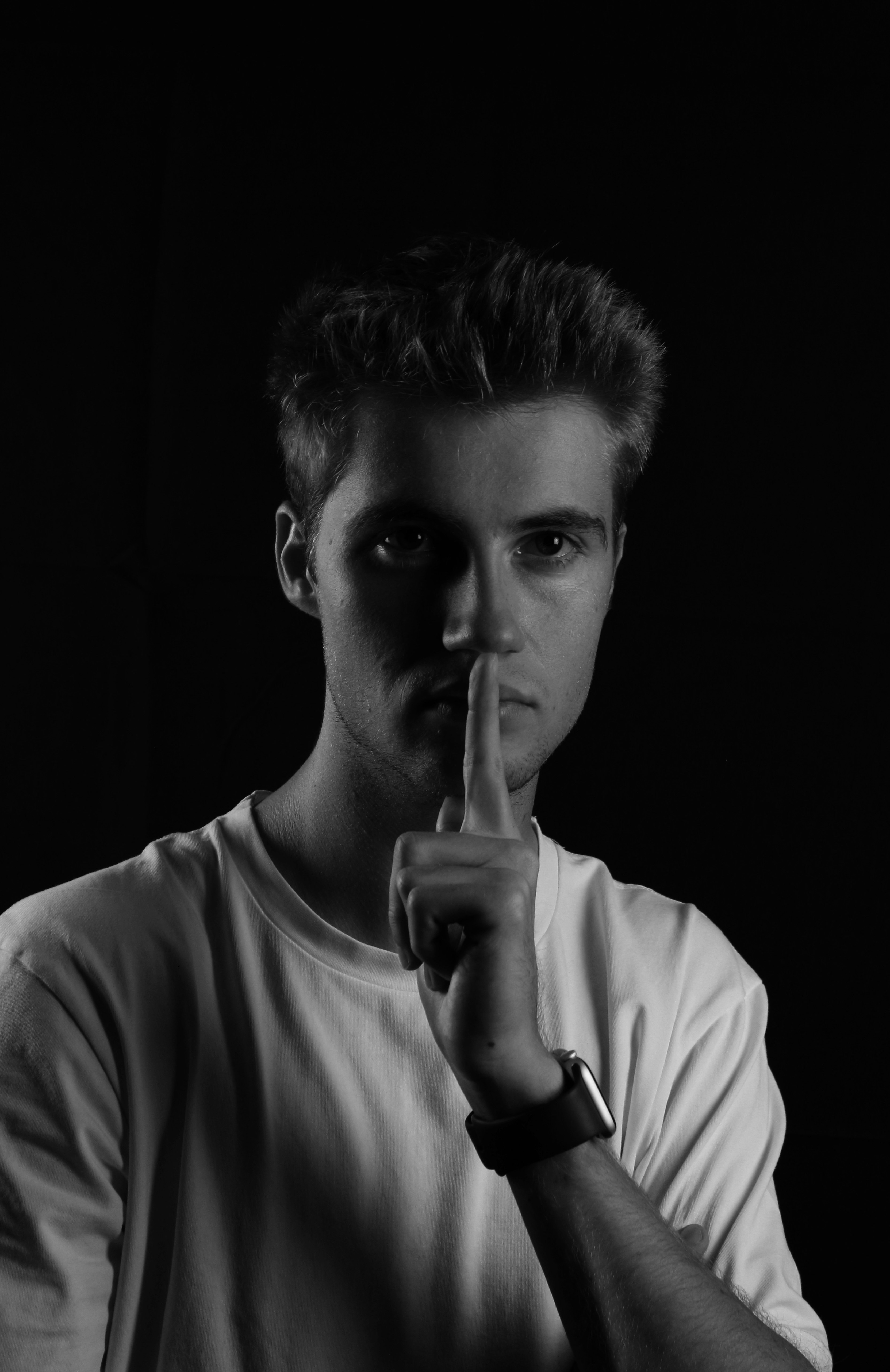 man in white crew neck shirt smoking