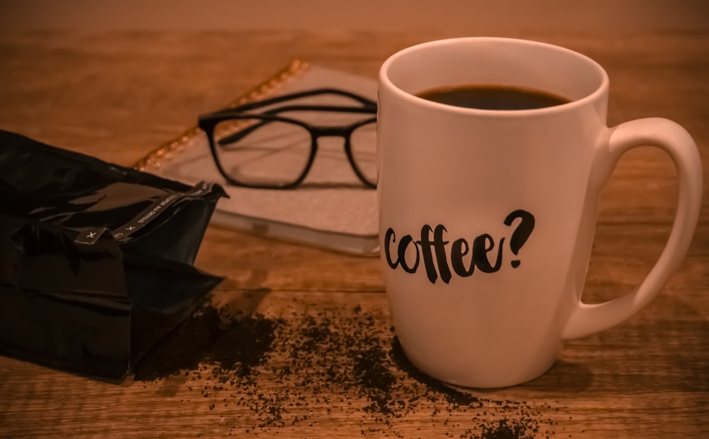 white ceramic mug with coffee