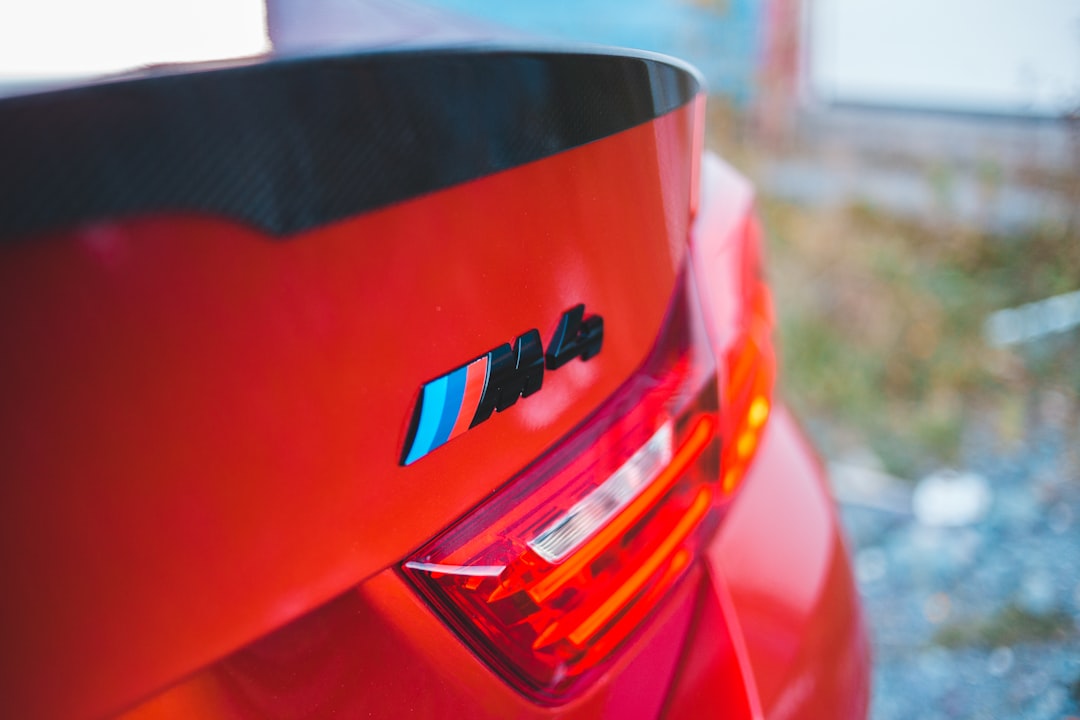 red and black car in close up photography