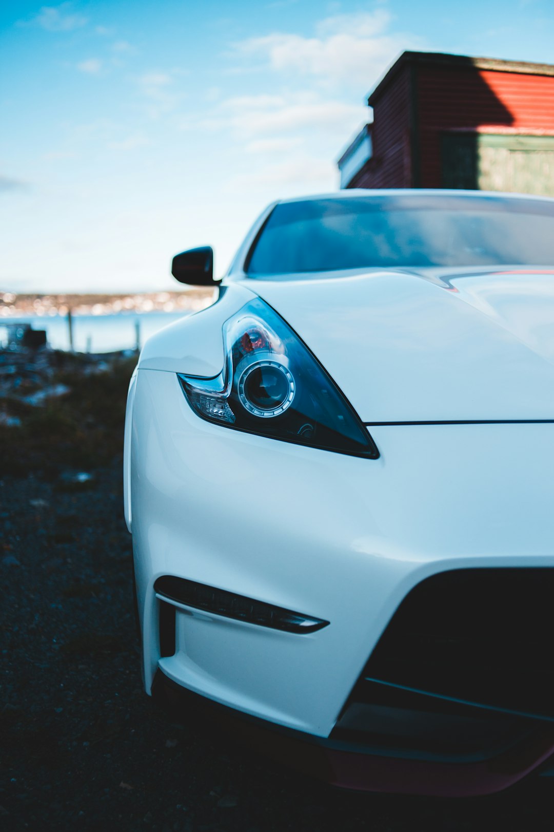 white porsche 911 parked on road during daytime