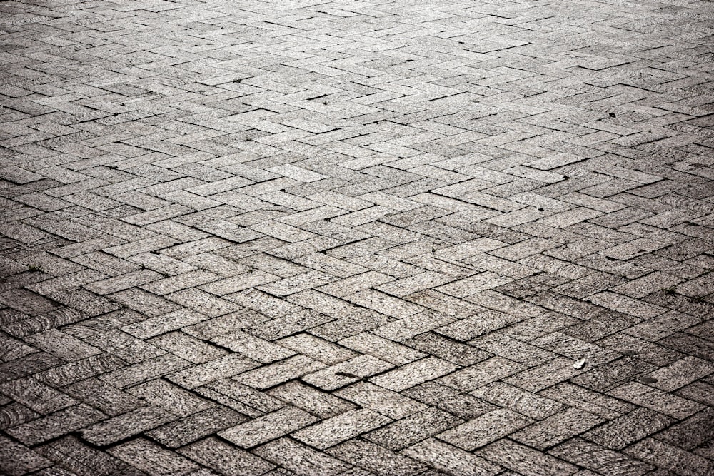 brown brick floor near body of water during daytime