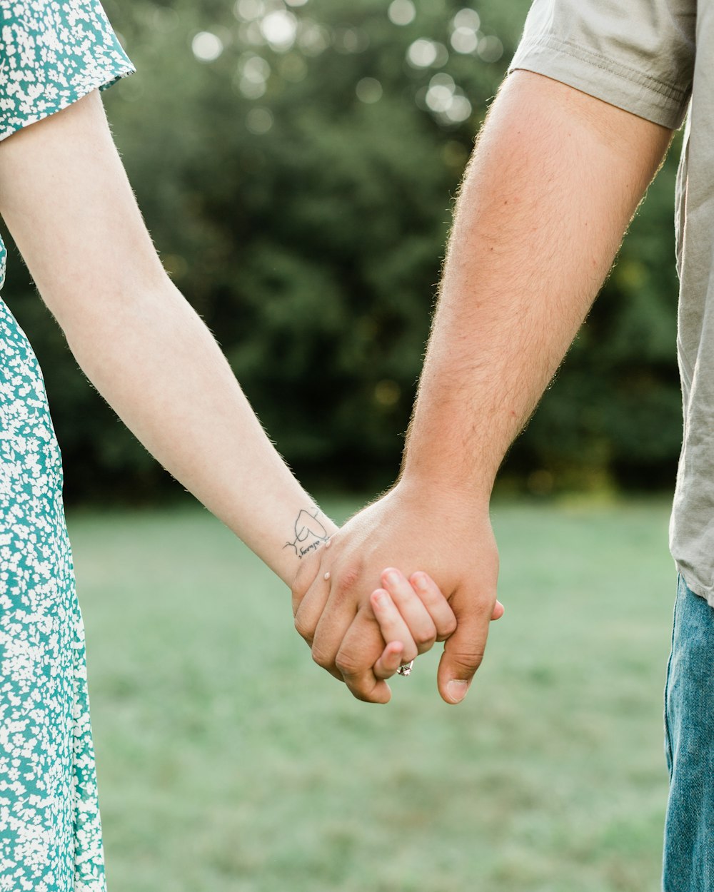 man and woman holding hands