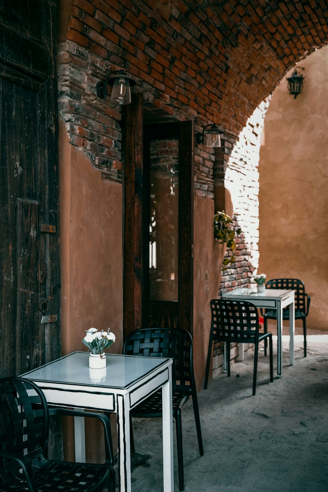 brown wooden door near brown wooden table and chairs