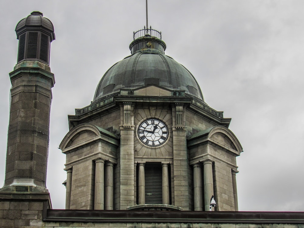 brown concrete building under white clouds during daytime