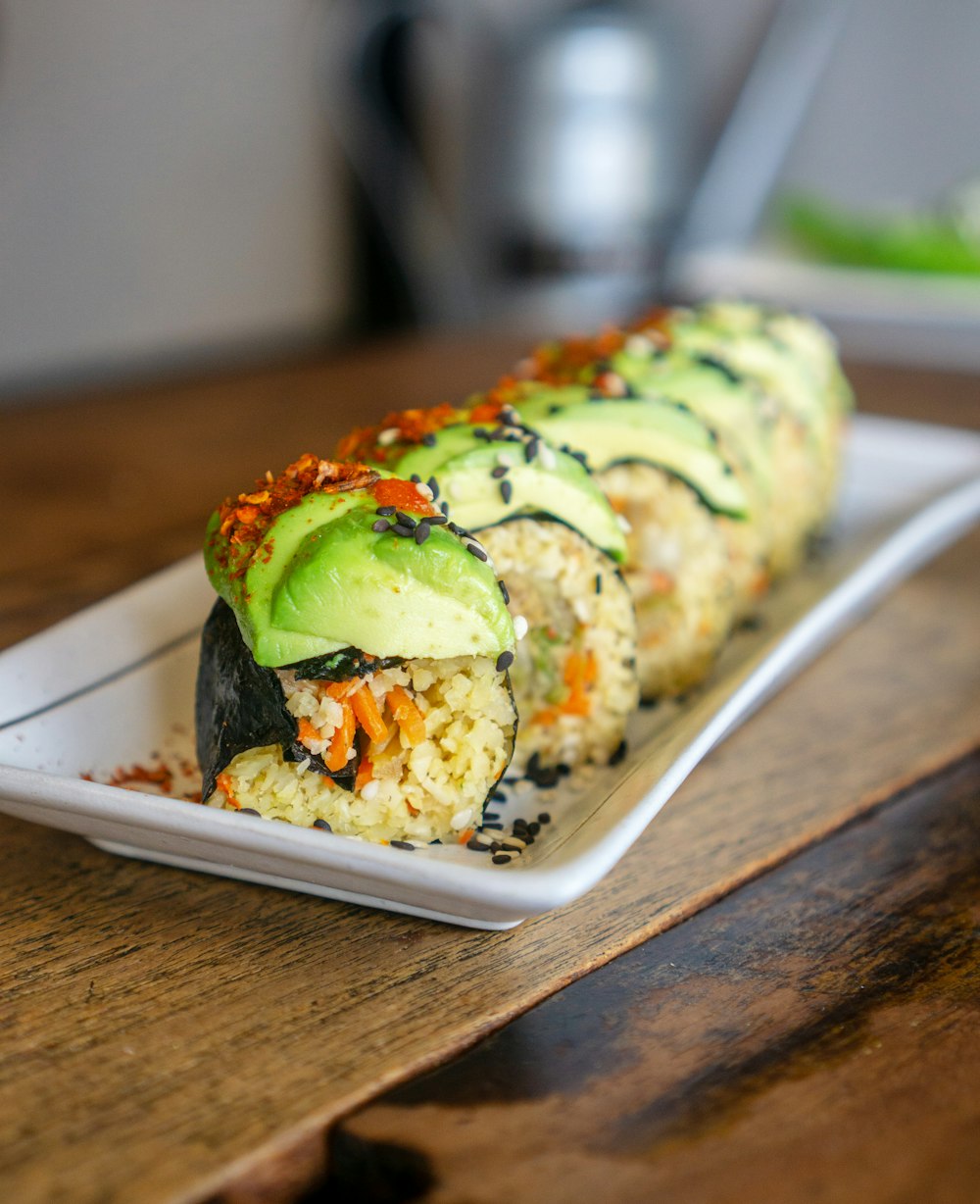 sushi on white ceramic rectangular plate