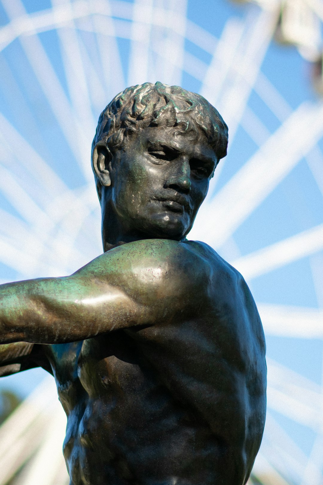 statue of man with blue background