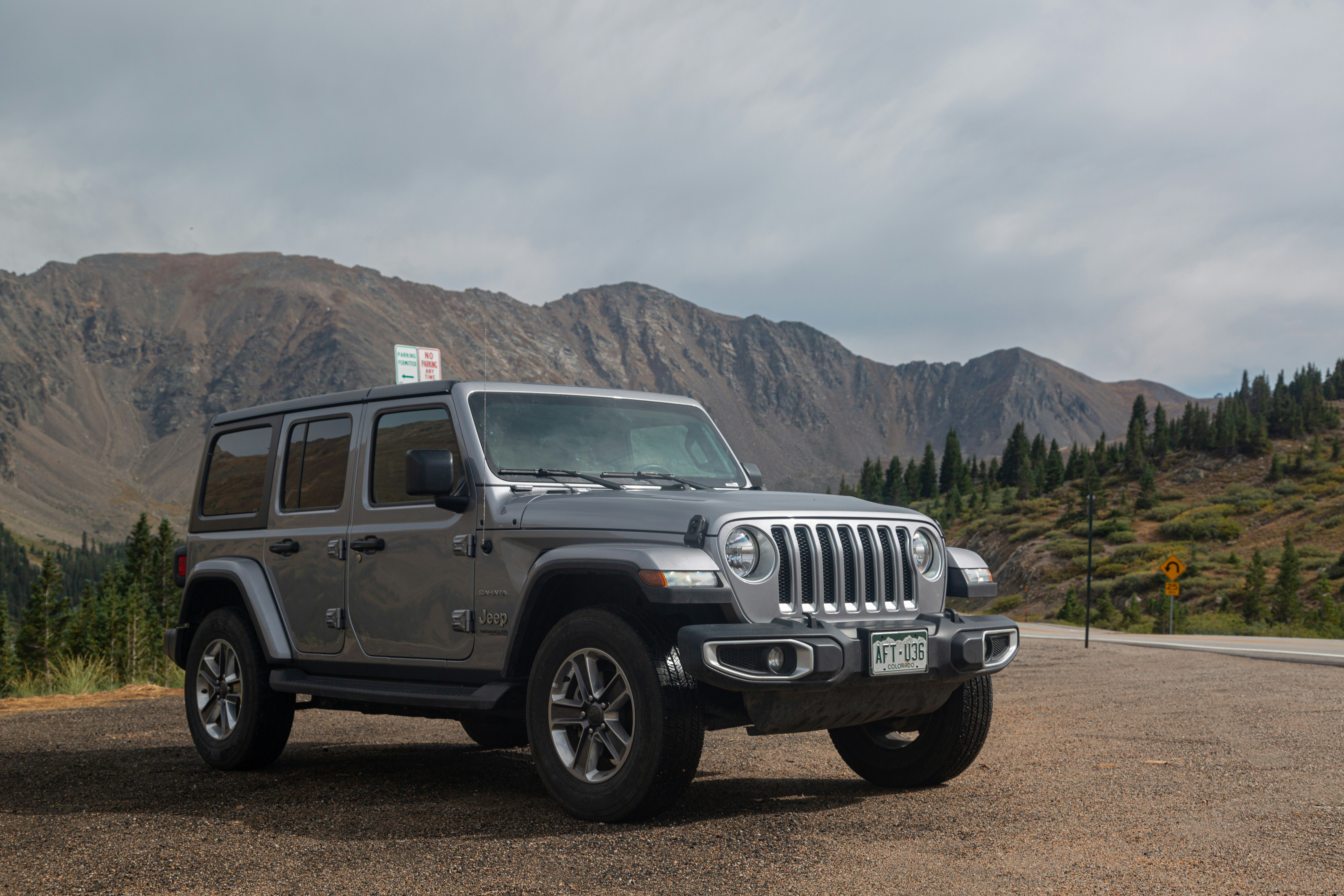 black jeep wrangler on dirt road during daytime