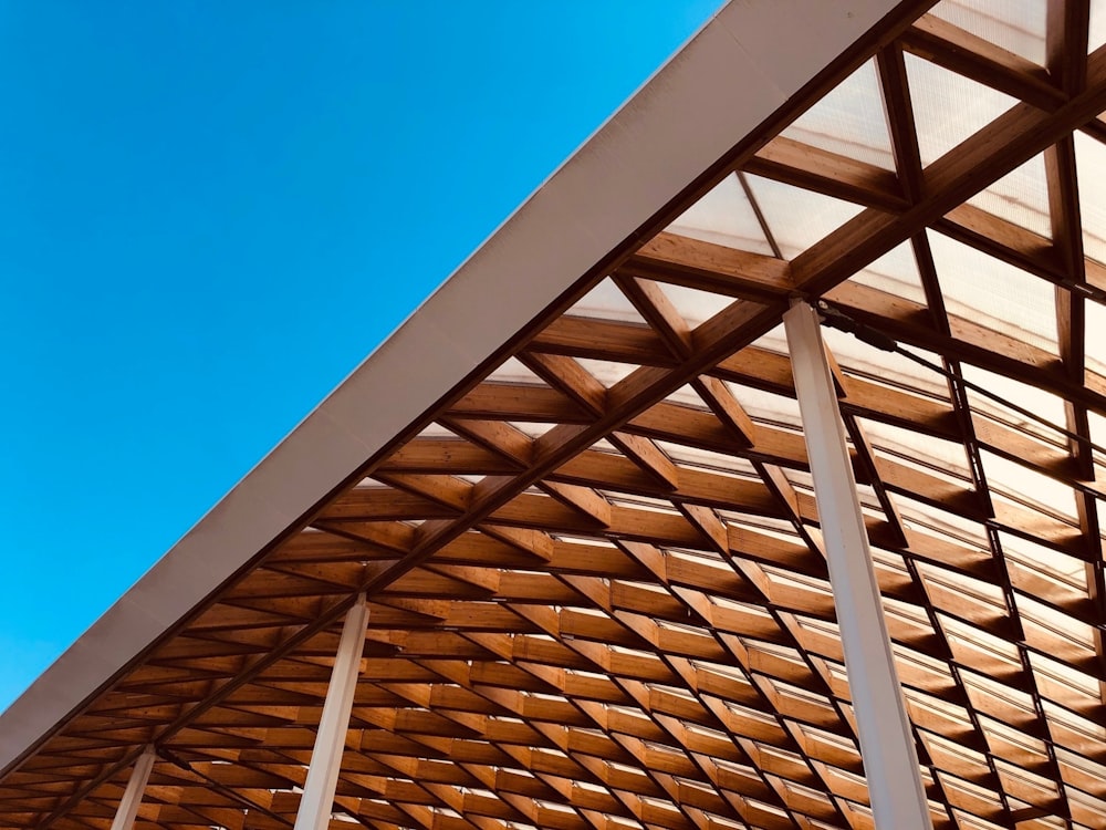 brown wooden roof under blue sky during daytime