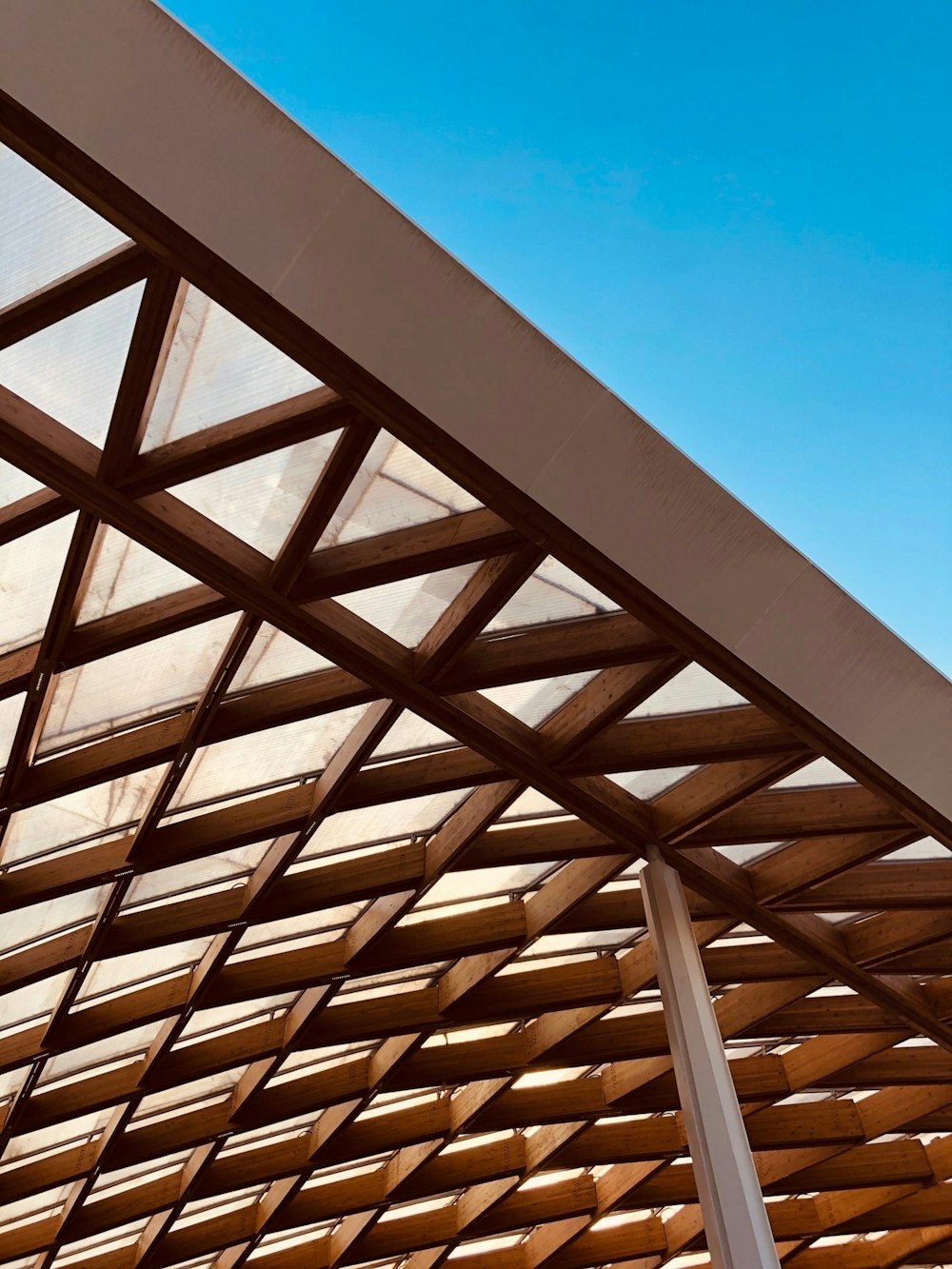 brown wooden roof under blue sky during daytime