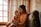 A warm and inviting living room with a caregiver and client sharing a moment.