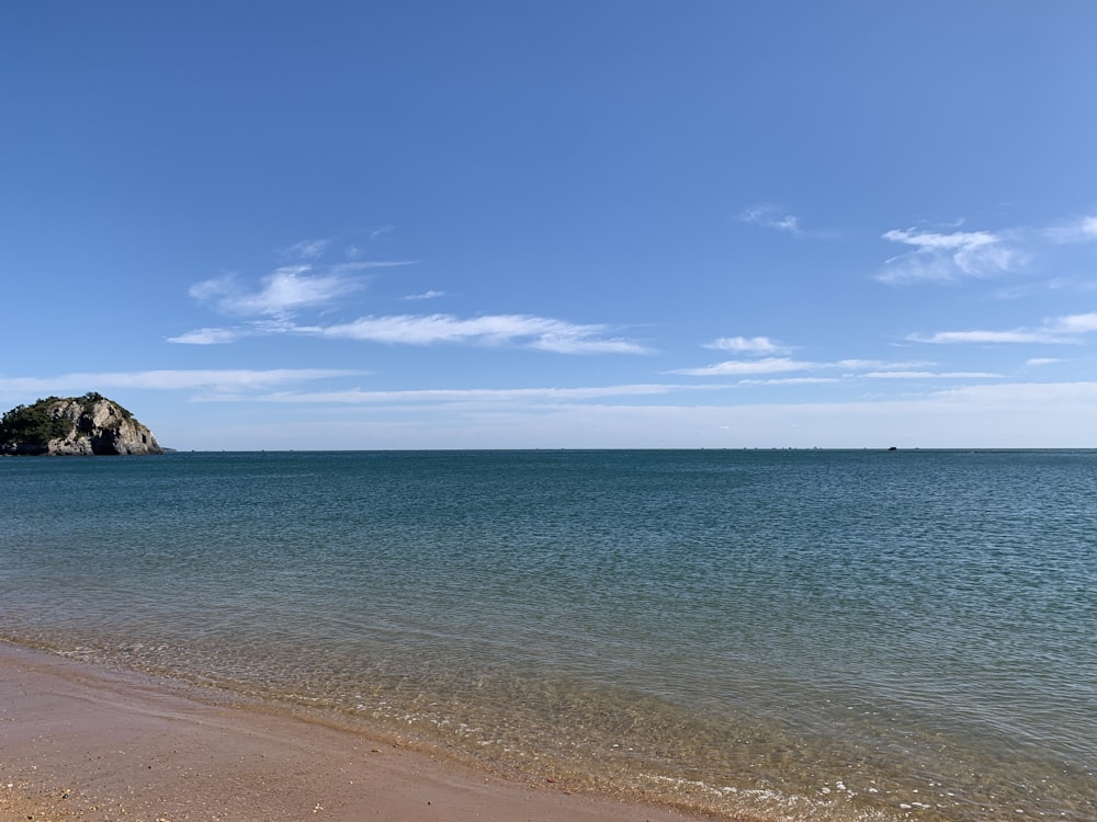 blue sea under blue sky during daytime