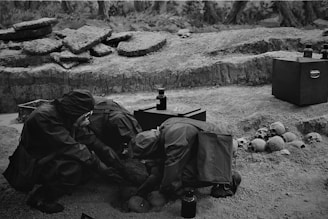 Team of archaeologists examining ancient artifacts on a coastal excavation site.