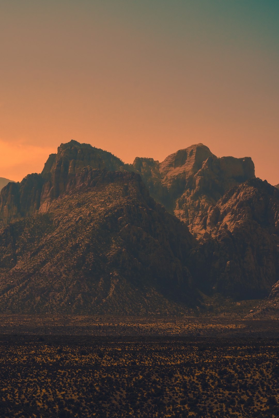 brown rocky mountain during sunset