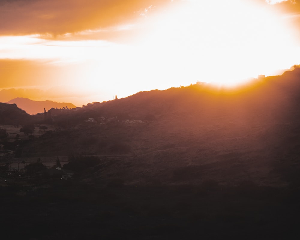 silhouette of mountain during sunset