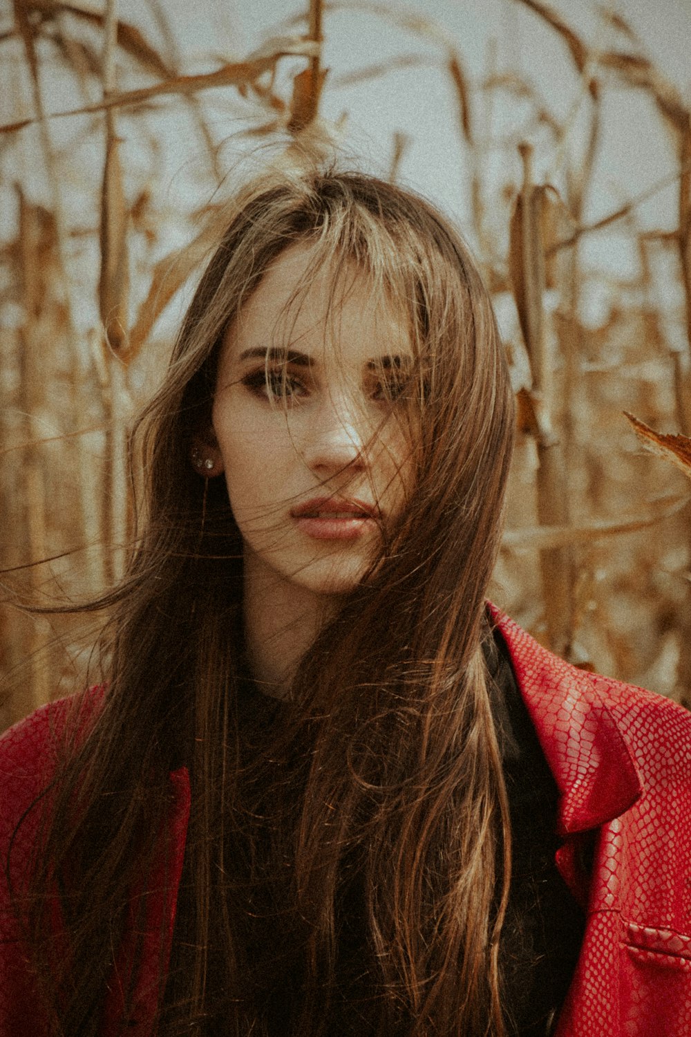 woman in red and black coat