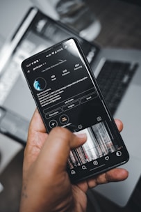 person holding black android smartphone