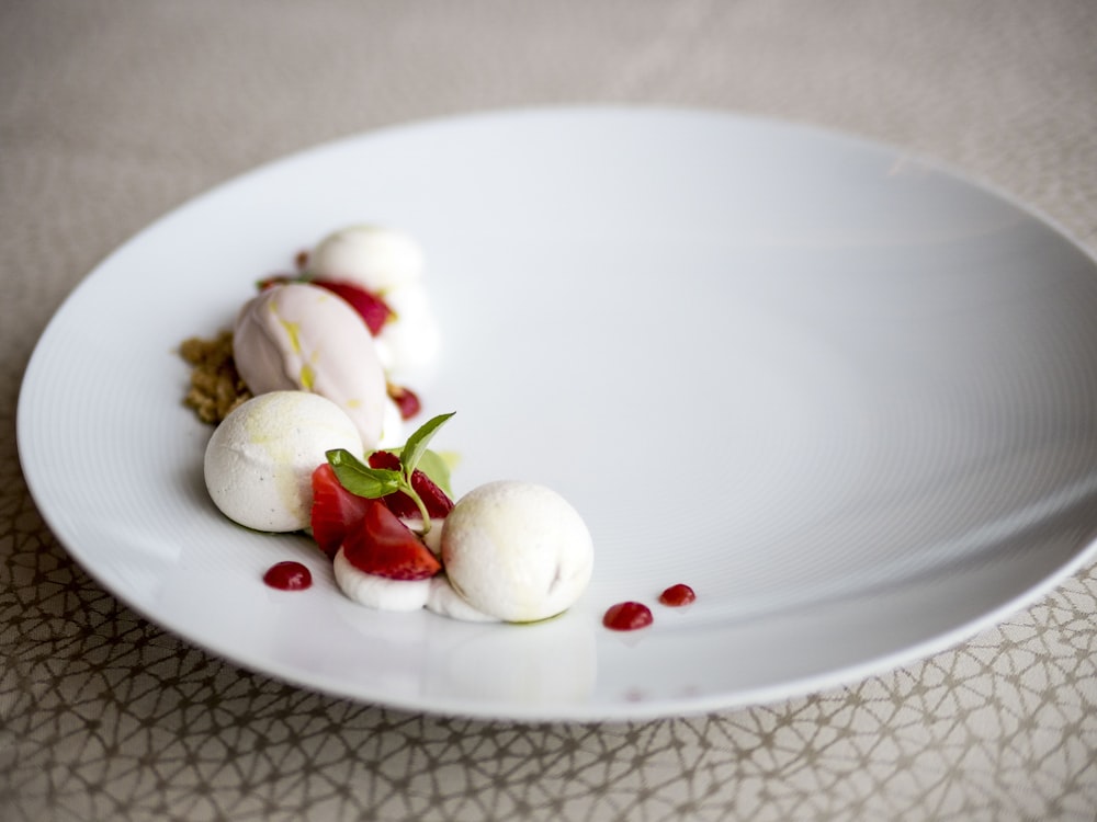 white ceramic plate with sliced fruits