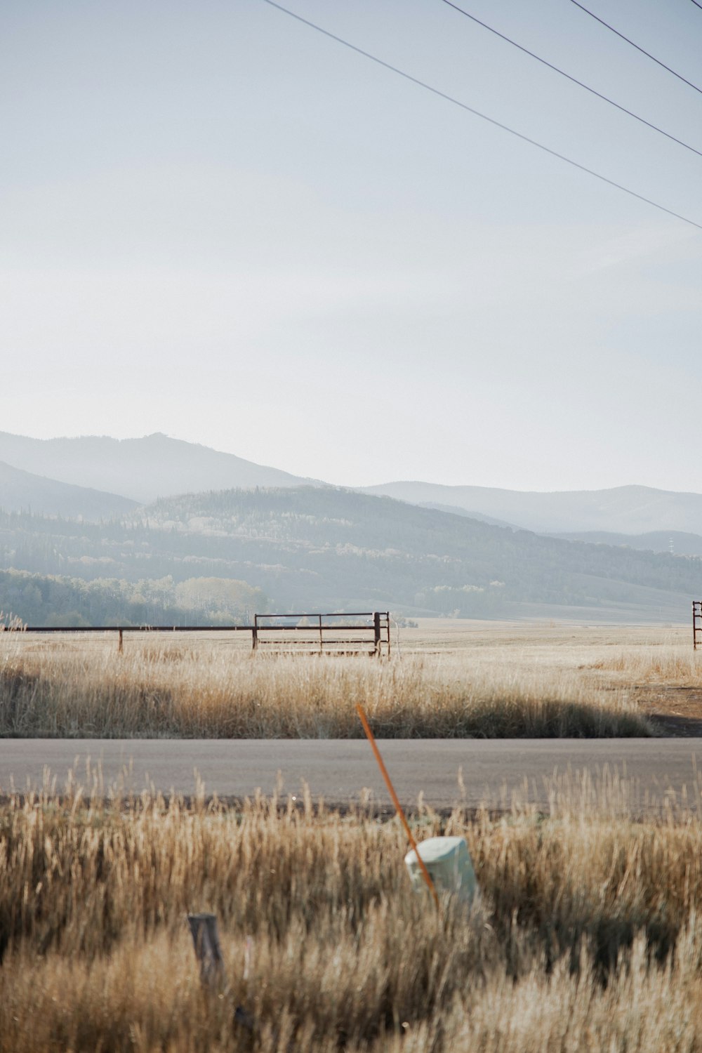 brown grass field near mountain during daytime