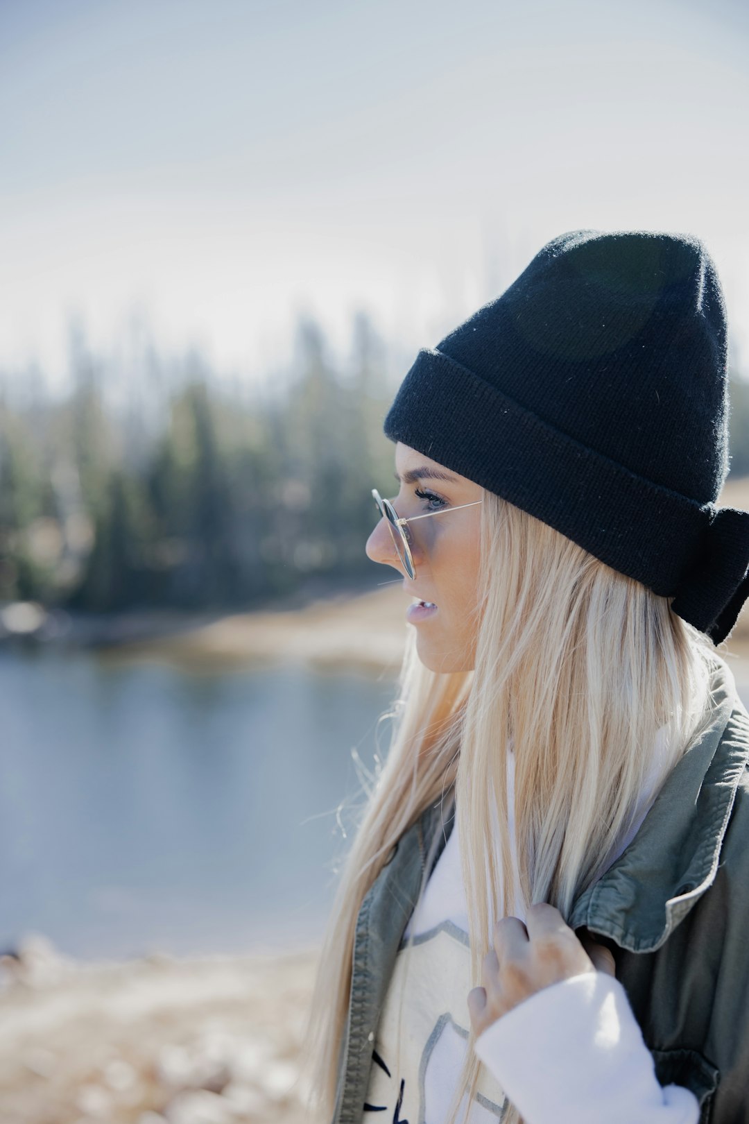 woman in black hat and white jacket