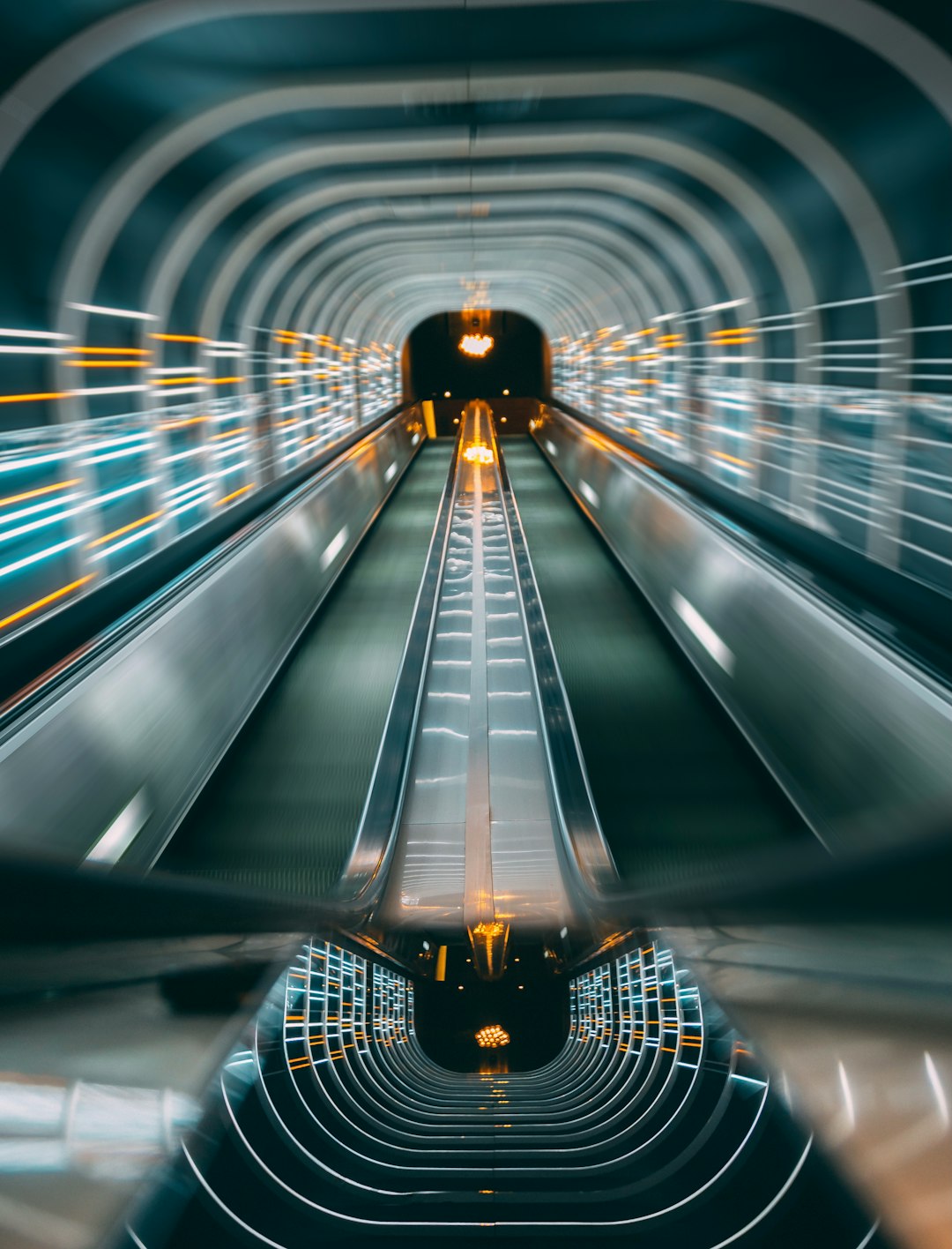 man in black jacket standing on tunnel