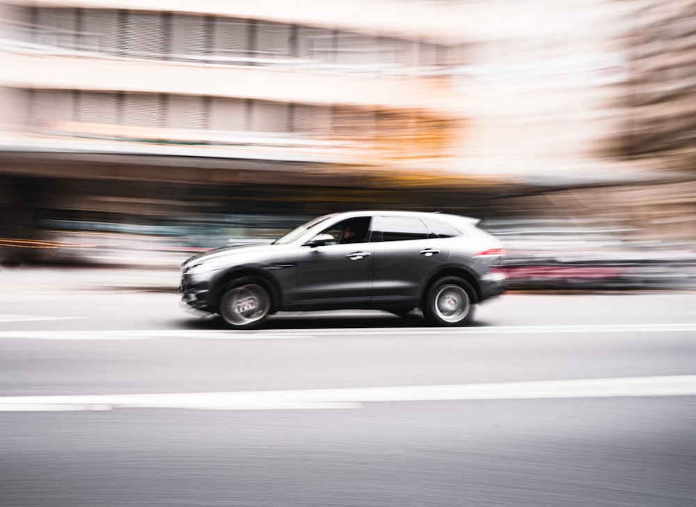 black sedan on road during daytime