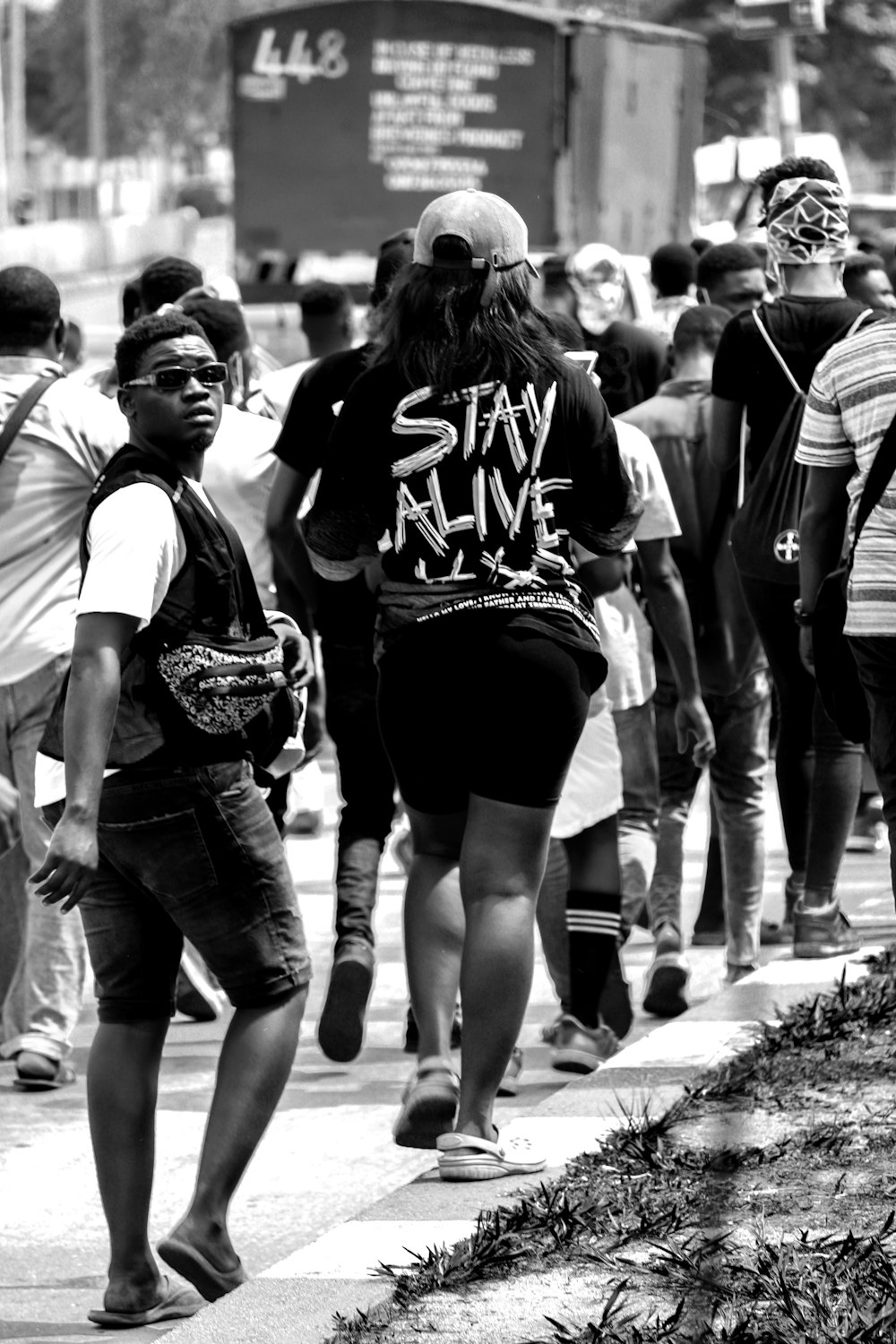 grayscale photo of people walking on street