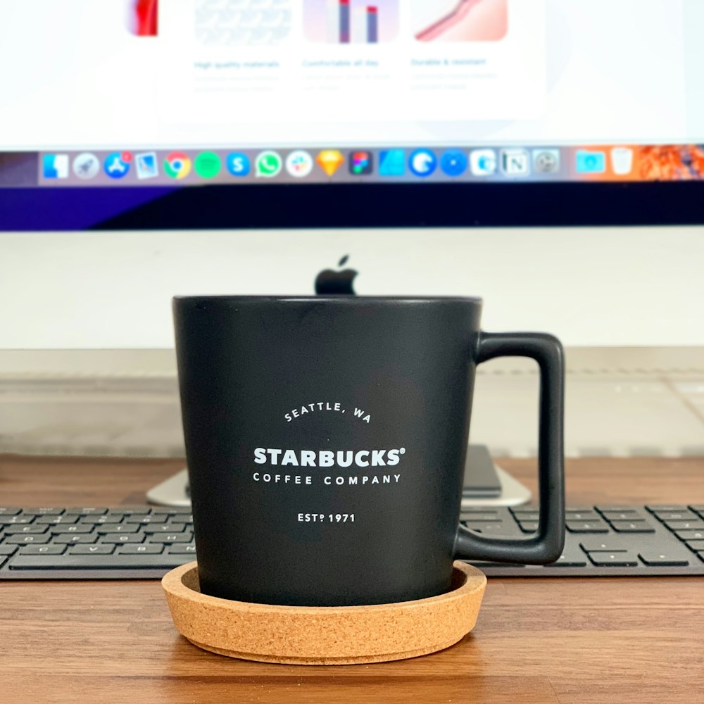 black ceramic mug on brown coaster