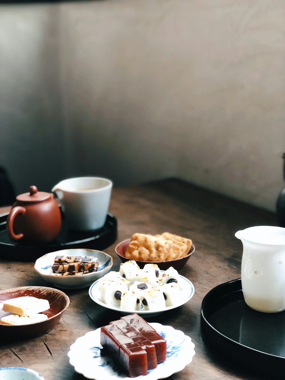 white ceramic mug on black ceramic plate