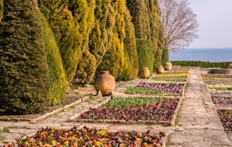 A beautifully landscaped garden with colorful flowers and pathways.