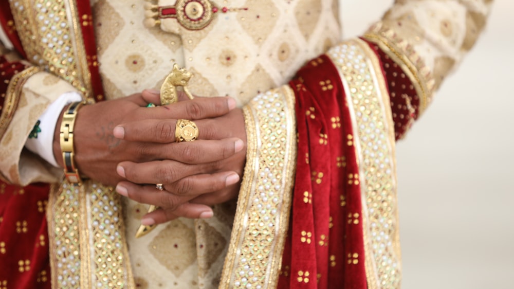 woman in red and gold sari