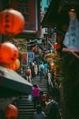 A group of travelers enjoying a guided tour through the bustling Muslim Quarter market.