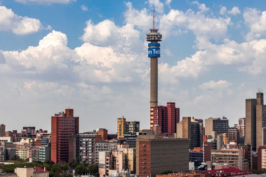 city skyline under blue and white cloudy sky during daytime in Johannesburg South Africa