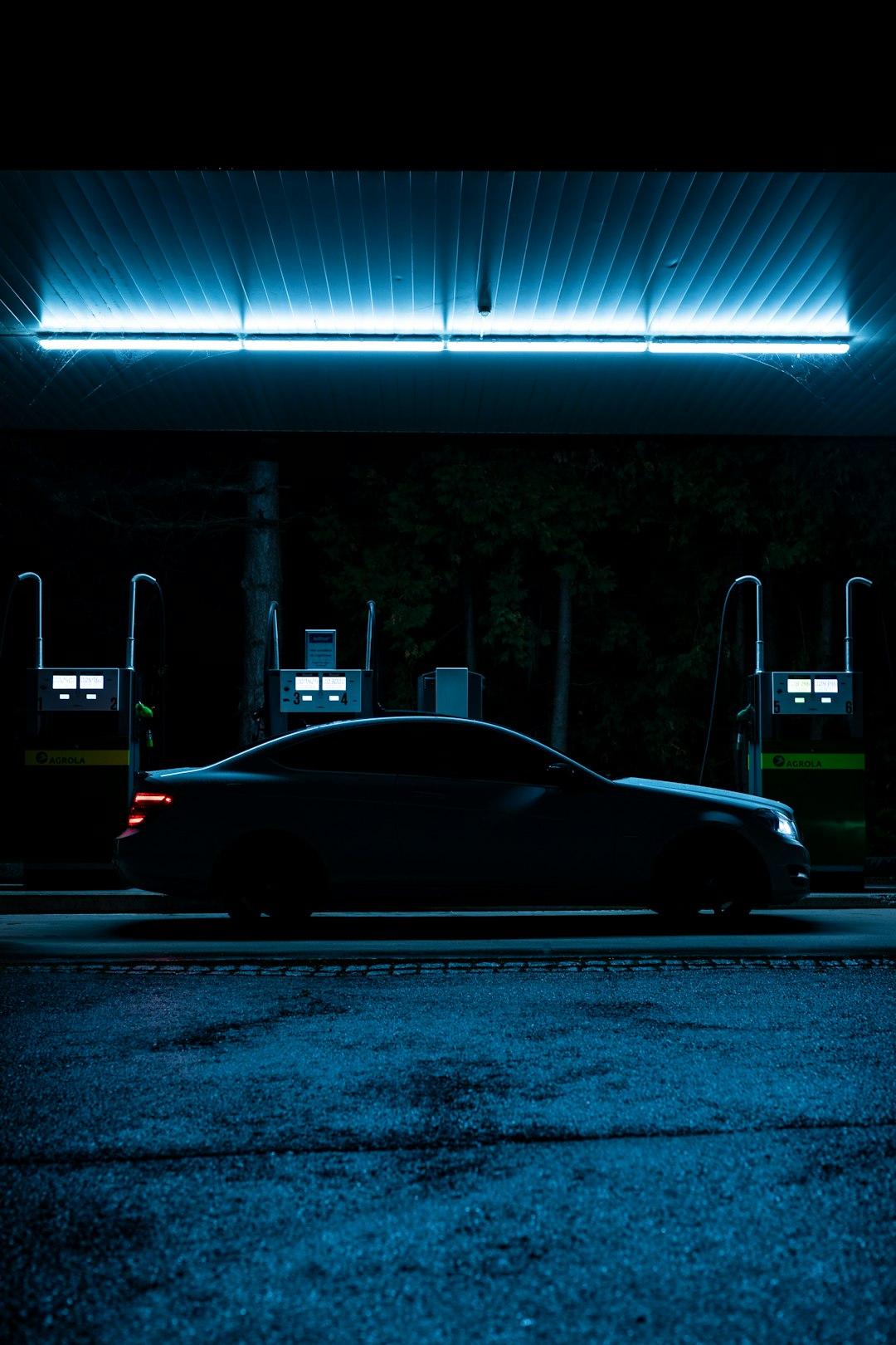 black sedan on road during night time
