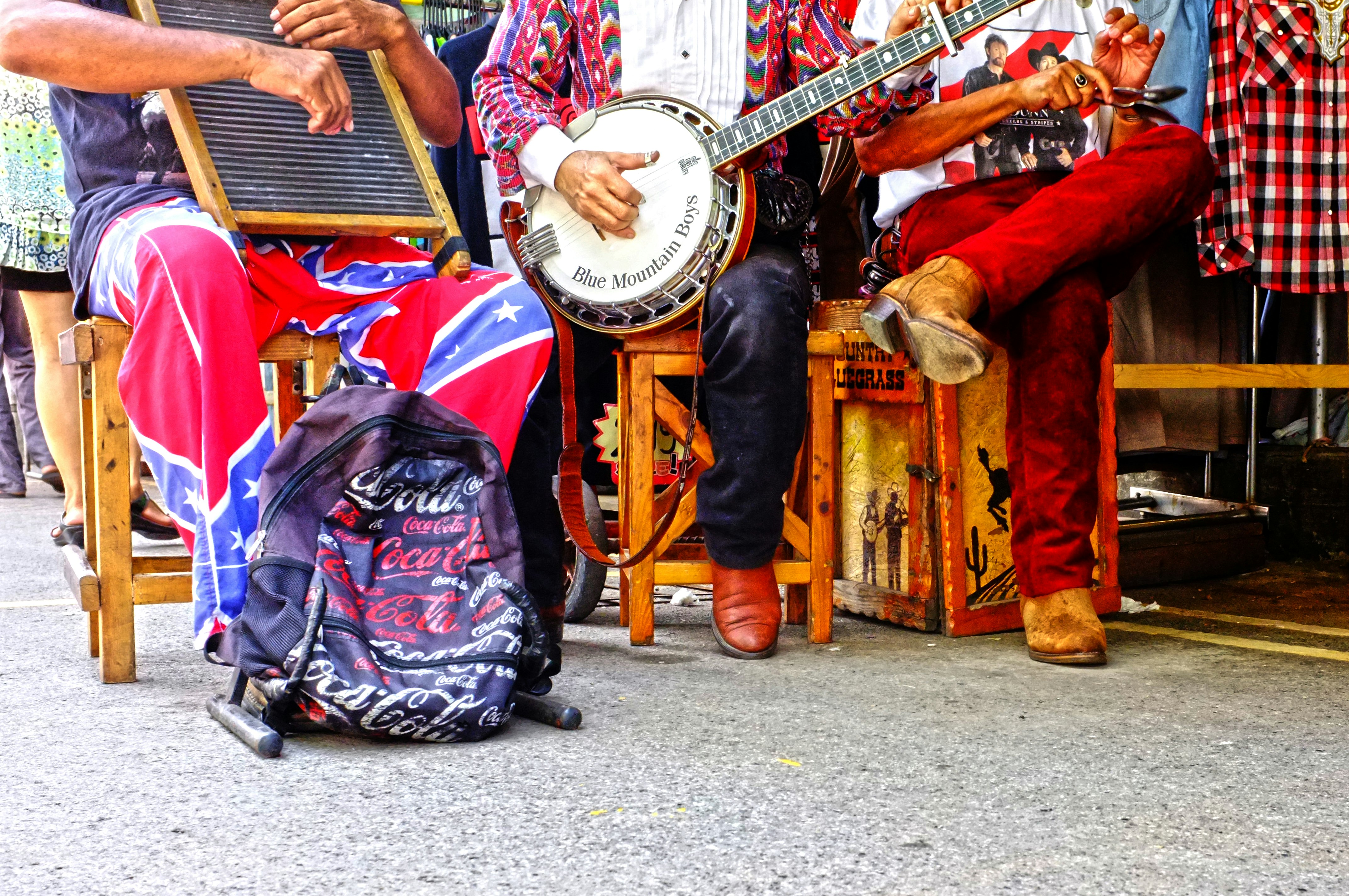 man in red jacket playing musical instrument