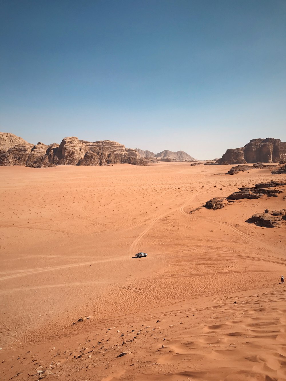 white car on desert during daytime