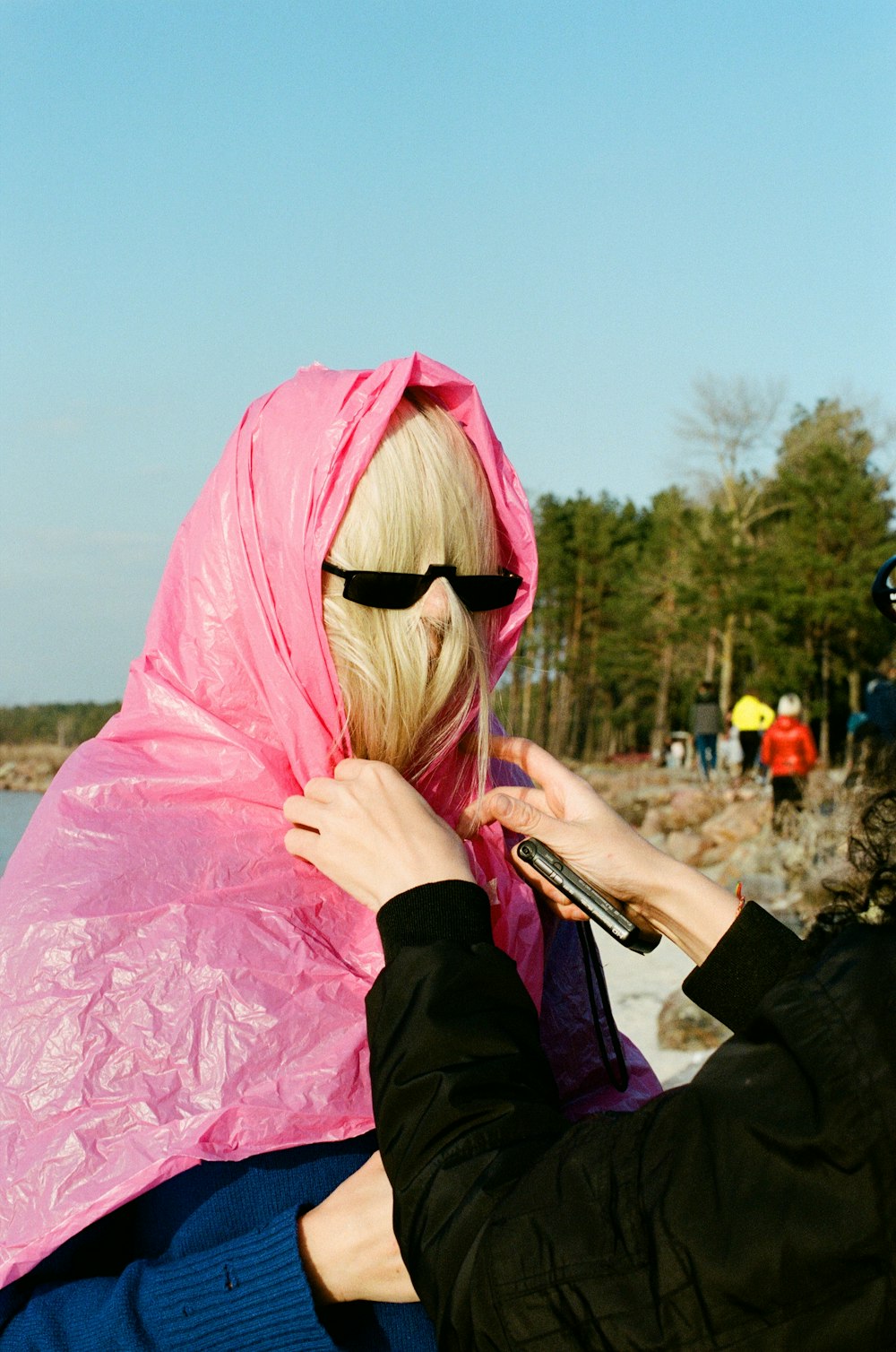 woman in pink hijab and black long sleeve shirt