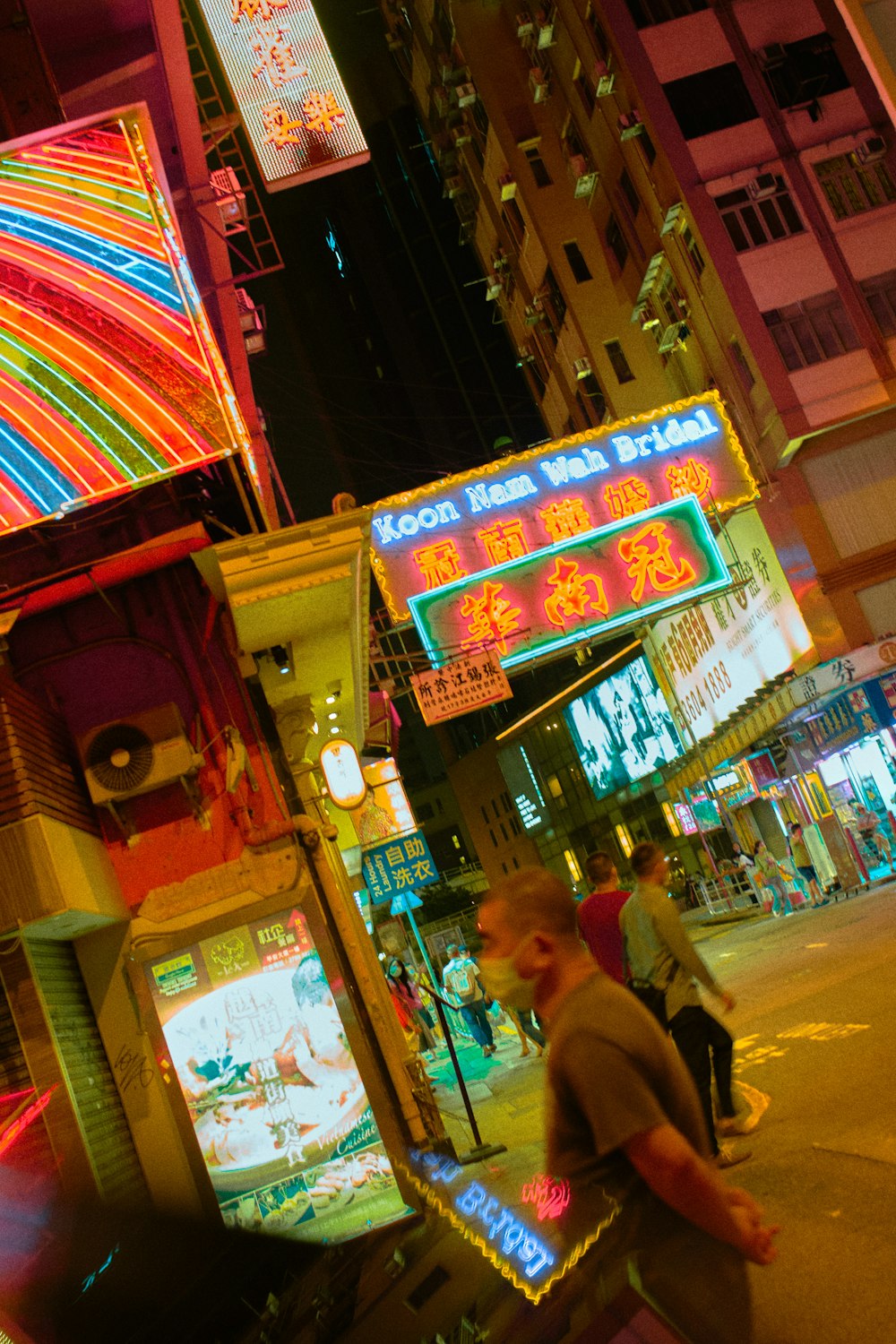 people walking on street during nighttime