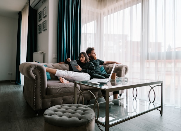 A young adult couple in an apartment kitchen, representing the millennial renters who make up nearly 57 percent of Las Vegas Valley renters