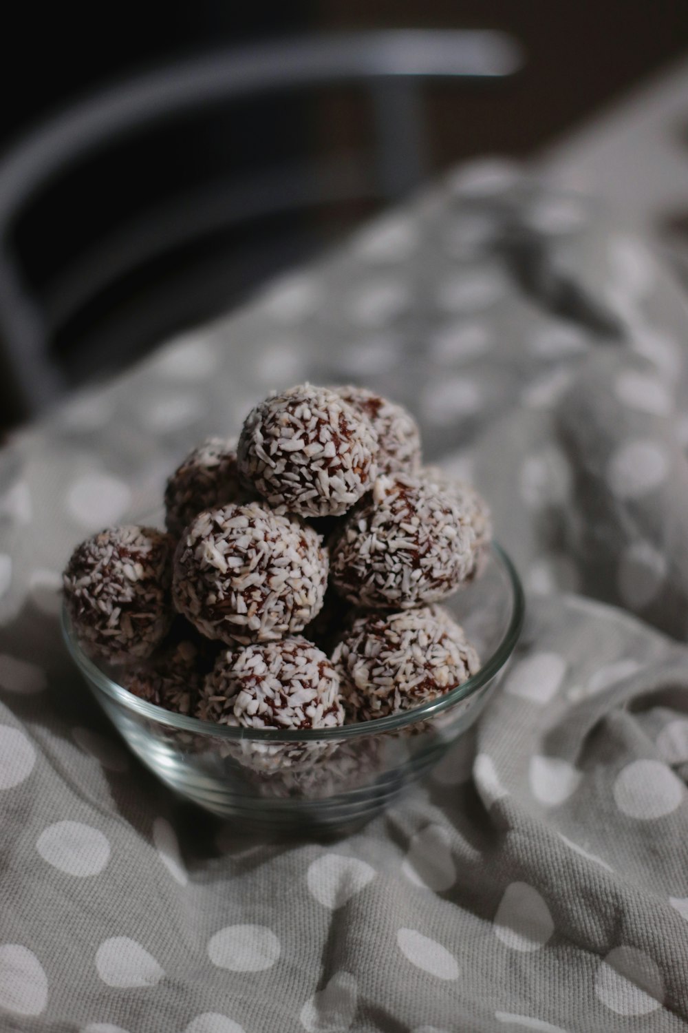 brown round fruit on clear glass bowl