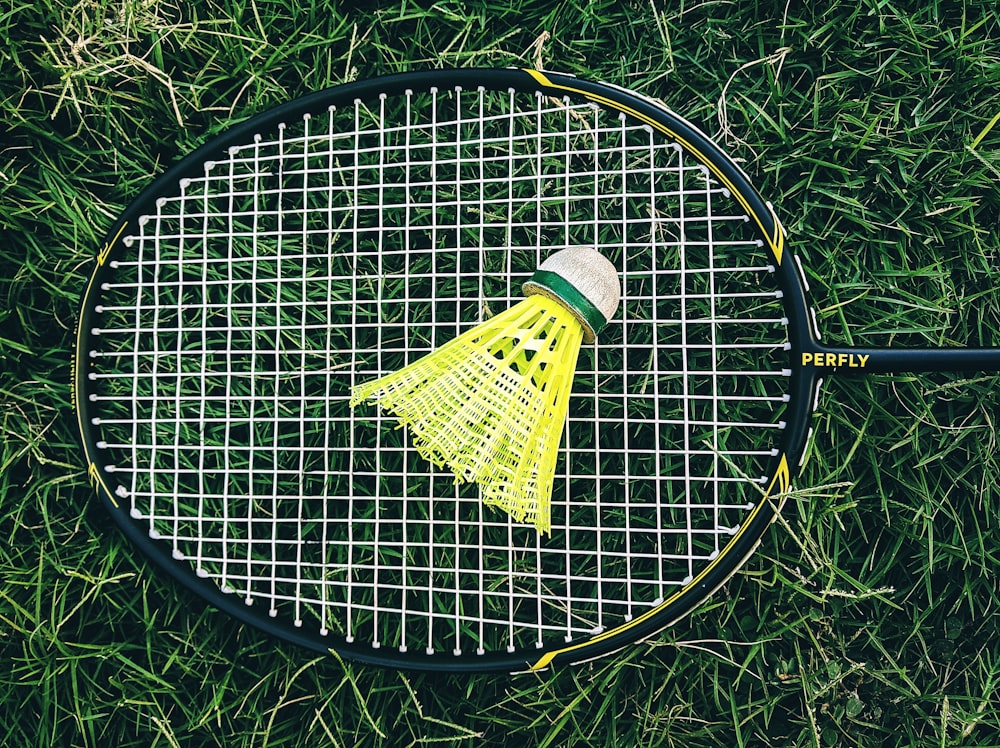 yellow and white bug zapper racket