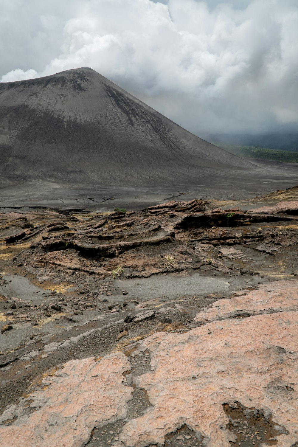 brown and gray mountain under white clouds during daytime