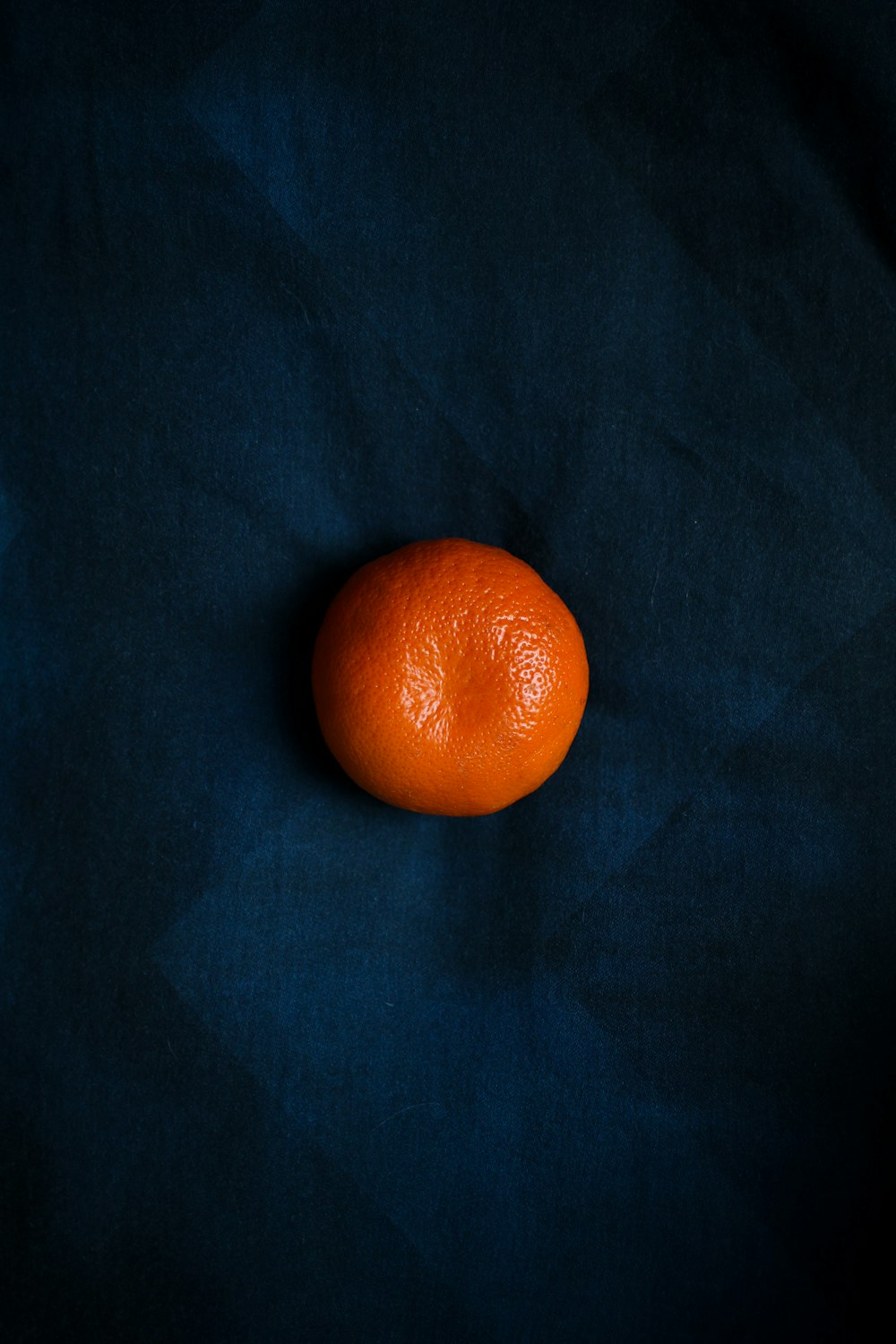 orange fruit on black textile