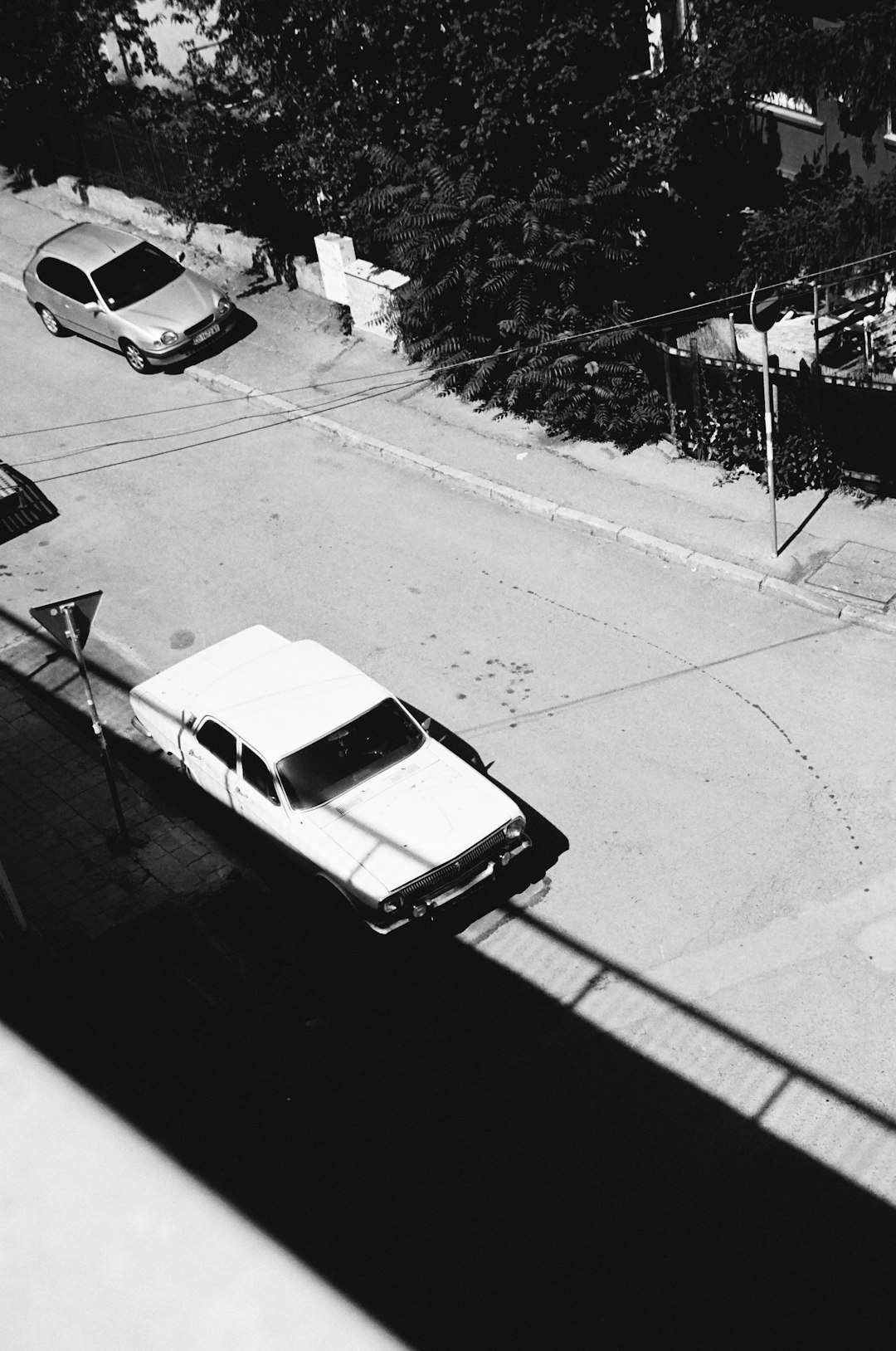 grayscale photo of cars on road