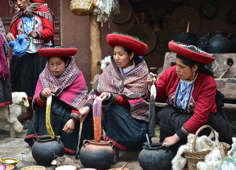 A group of women engaged in traditional handicraft activities.